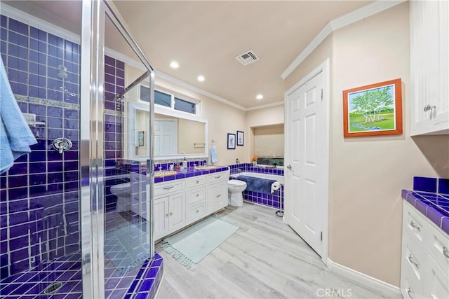 full bathroom featuring toilet, vanity, crown molding, hardwood / wood-style flooring, and independent shower and bath