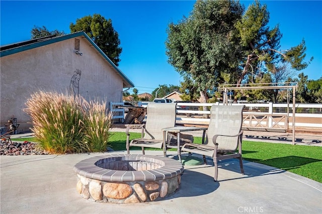 view of patio with an outdoor fire pit