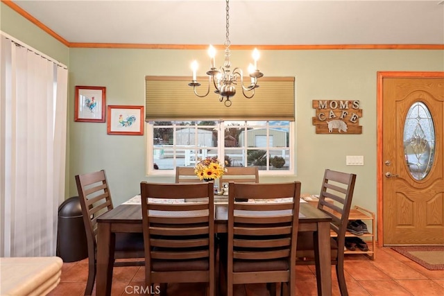 tiled dining room featuring a notable chandelier, a wealth of natural light, and ornamental molding