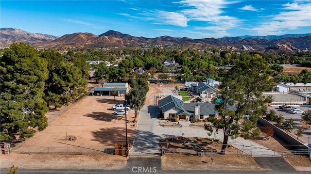 birds eye view of property with a mountain view