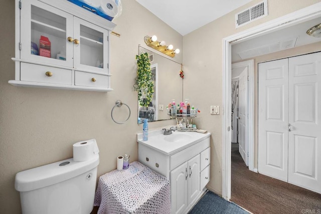 bathroom with toilet and vanity