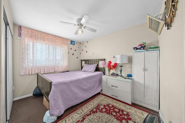 bedroom with ceiling fan and a closet