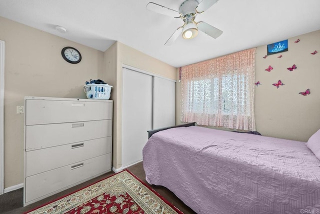 bedroom featuring ceiling fan and a closet