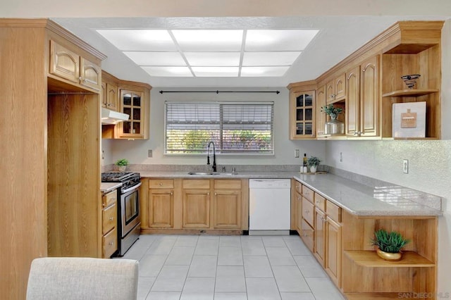 kitchen with dishwasher, stainless steel gas range oven, sink, and light brown cabinets