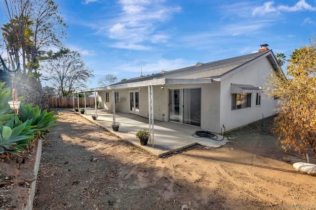 rear view of house with a patio