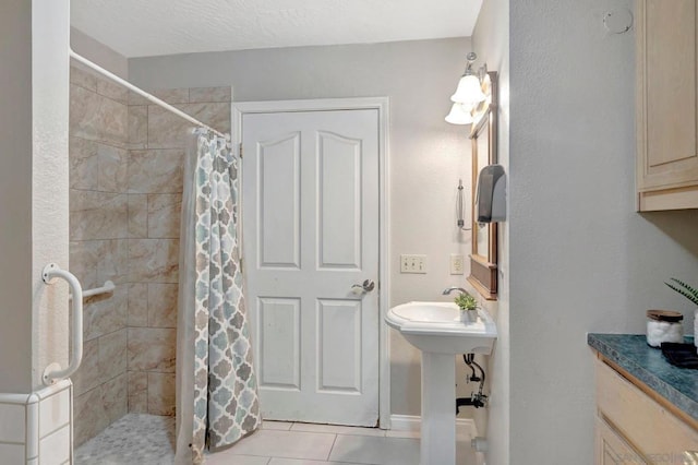 bathroom featuring tile patterned floors and a shower with shower curtain