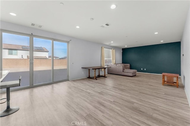 unfurnished room with light wood-type flooring