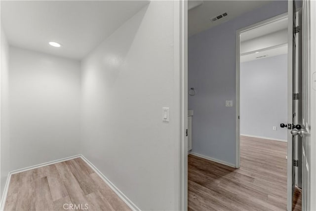 corridor featuring light hardwood / wood-style flooring