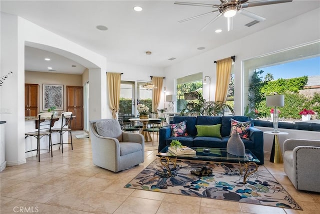 living room featuring ceiling fan and light tile patterned flooring