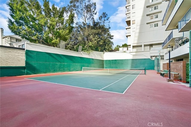 view of sport court featuring basketball hoop