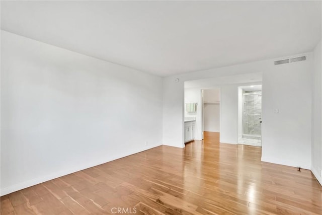 unfurnished room with light hardwood / wood-style floors