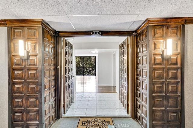 corridor featuring light tile patterned flooring