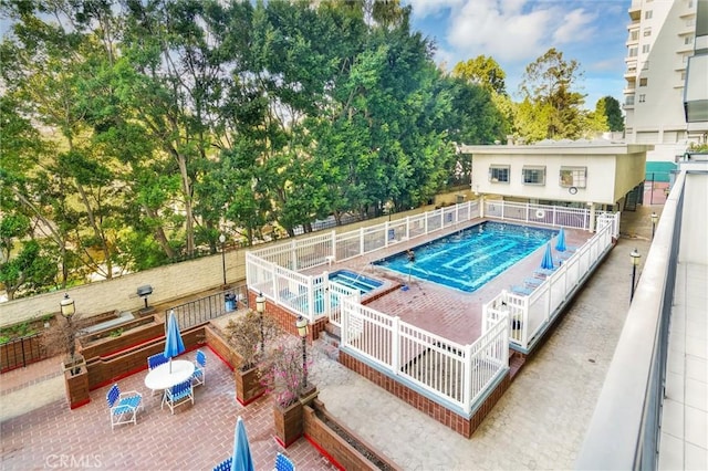 view of swimming pool with a patio