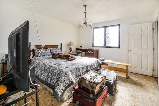 bedroom with a chandelier