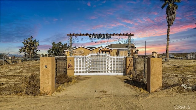 view of gate at dusk