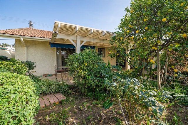 exterior space with a pergola and a patio area