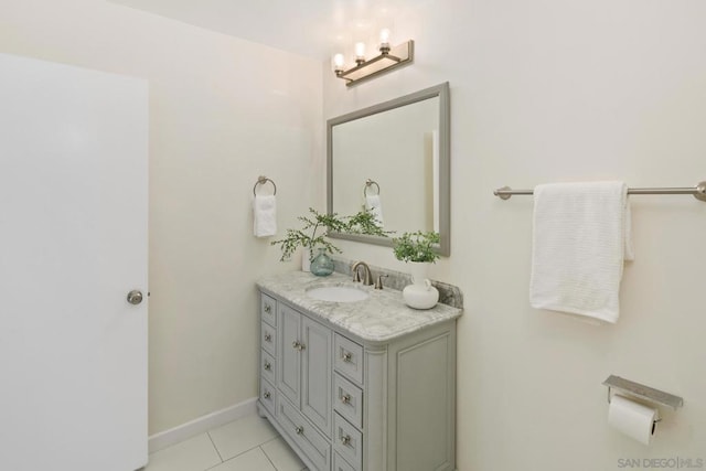 bathroom featuring vanity, a notable chandelier, and tile patterned floors