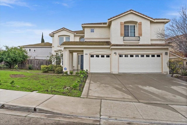 view of front of property featuring a garage and a front lawn