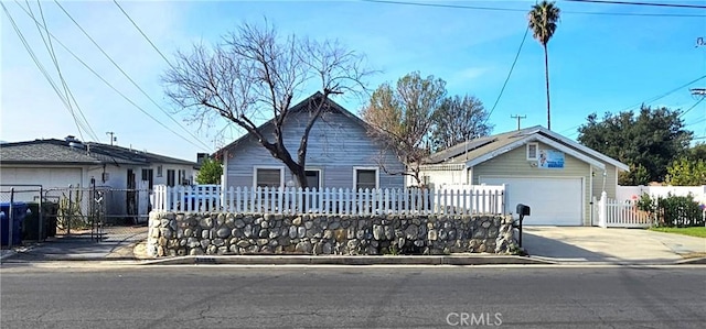 view of front facade with a garage and an outbuilding