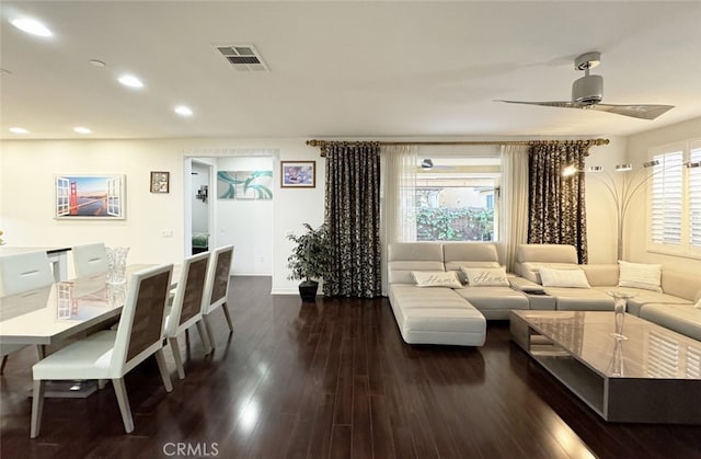 living area with dark wood-style floors, visible vents, recessed lighting, and ceiling fan