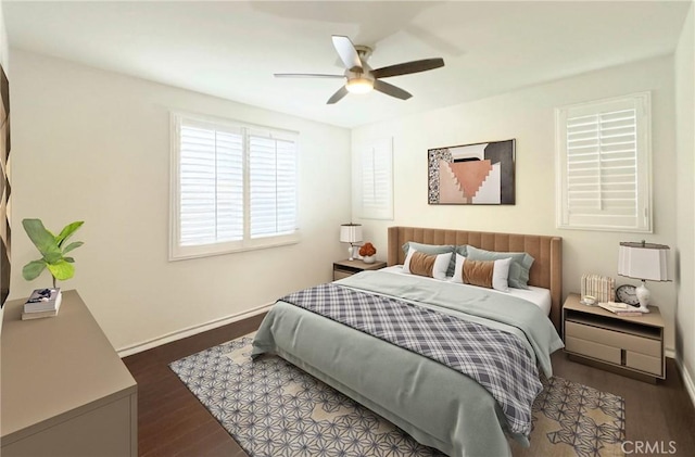 bedroom with ceiling fan, baseboards, and wood finished floors