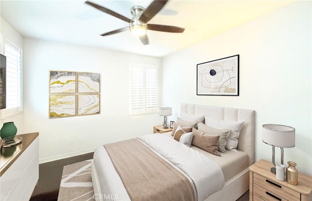 bedroom featuring baseboards and ceiling fan