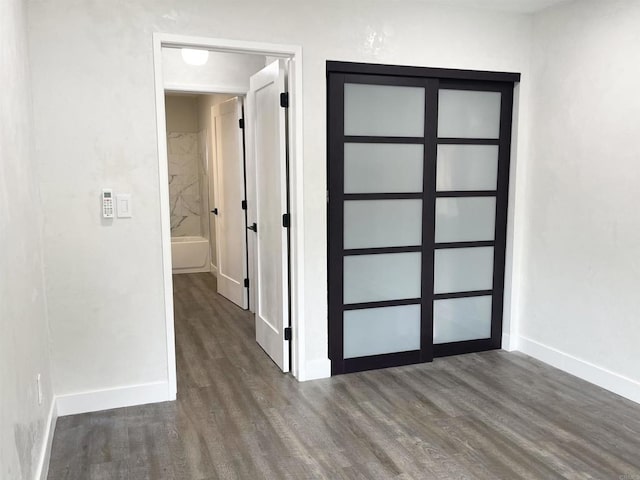 hallway featuring dark hardwood / wood-style floors