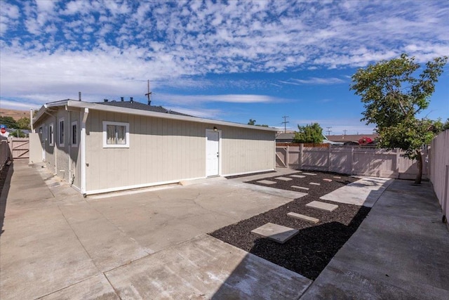 view of side of property with a patio