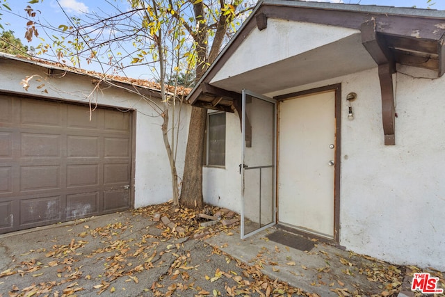 entrance to property featuring a garage