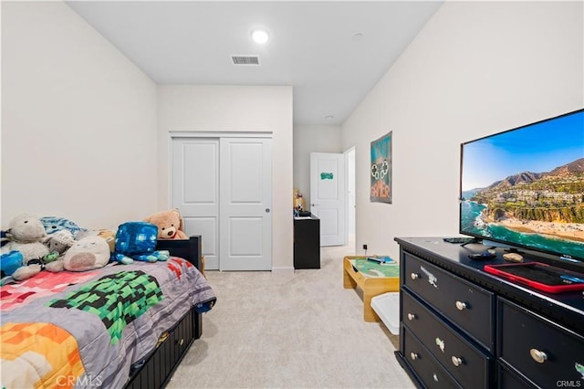 carpeted bedroom featuring a closet