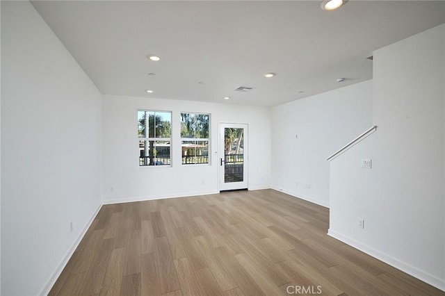 unfurnished room featuring light wood-type flooring