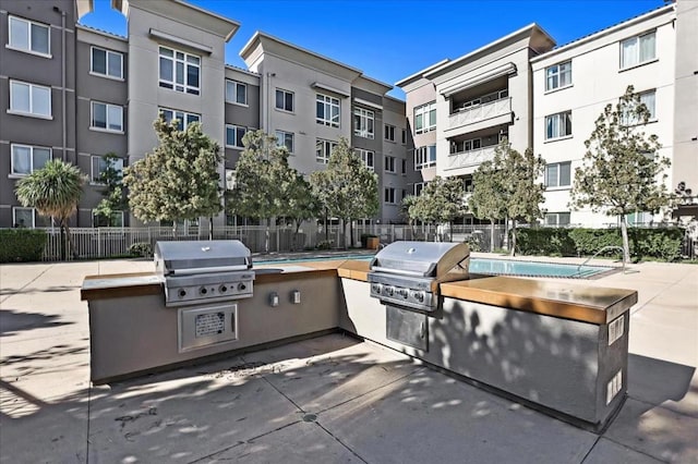 view of patio with area for grilling and grilling area