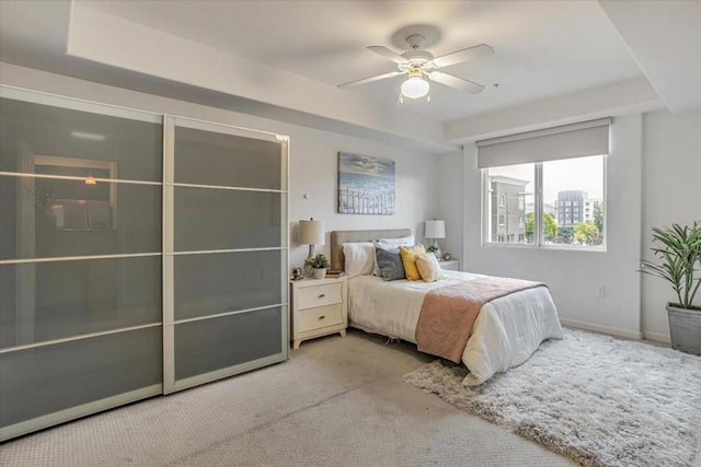 carpeted bedroom featuring ceiling fan