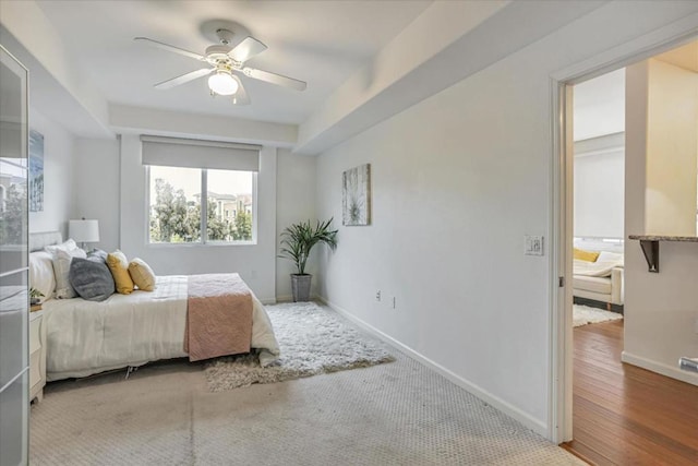 bedroom featuring hardwood / wood-style flooring and ceiling fan