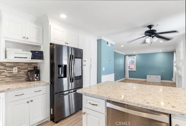 kitchen with ceiling fan, white cabinets, stainless steel fridge, and light wood-type flooring