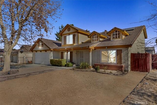 view of front of house featuring solar panels and a garage