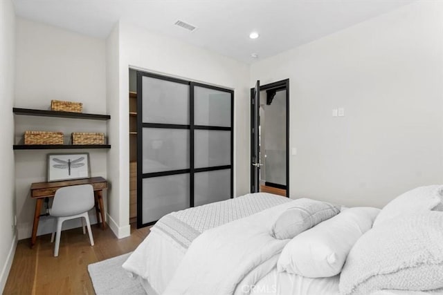 bedroom with light wood-type flooring