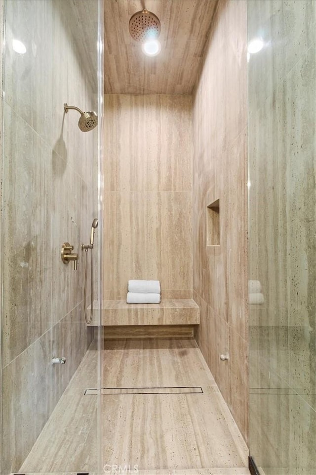 bathroom featuring tiled shower