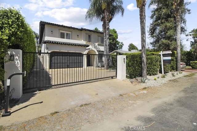 view of gate featuring a garage