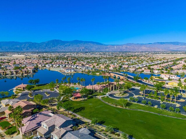 birds eye view of property featuring a water and mountain view