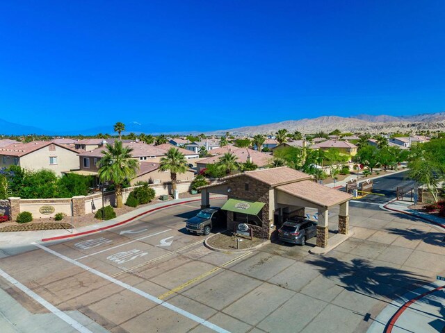 birds eye view of property with a mountain view