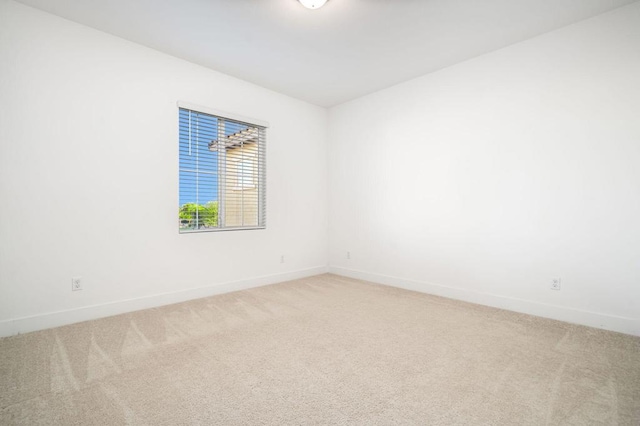 unfurnished room featuring carpet floors