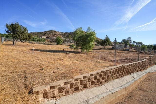 view of yard with a rural view