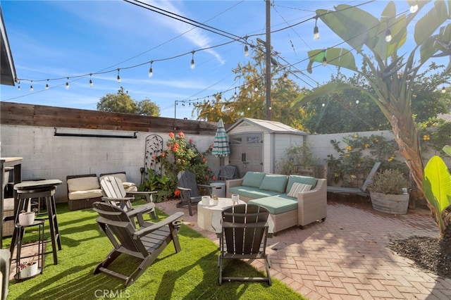 view of patio / terrace featuring an outdoor hangout area and a storage unit