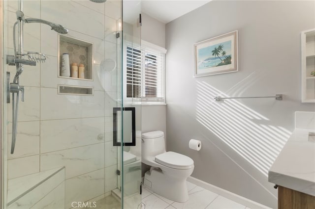 bathroom with an enclosed shower, vanity, and toilet