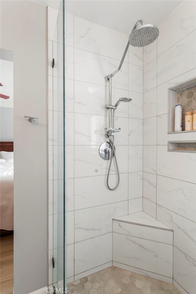 bathroom with a tile shower