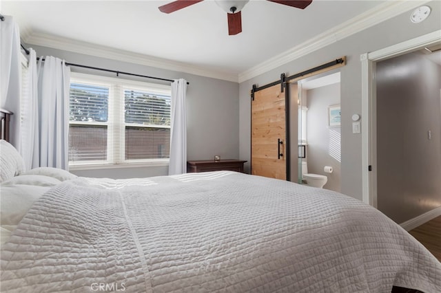 bedroom with ceiling fan, ornamental molding, a barn door, and hardwood / wood-style floors