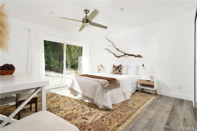 bedroom with ceiling fan, access to exterior, and dark hardwood / wood-style flooring