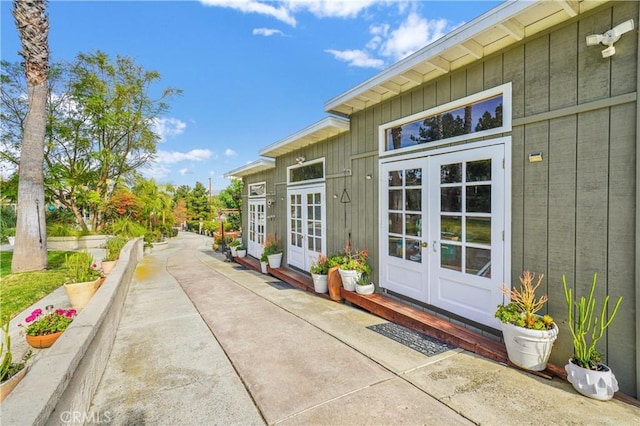 view of exterior entry featuring french doors