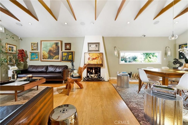 living room featuring hardwood / wood-style floors and lofted ceiling with beams